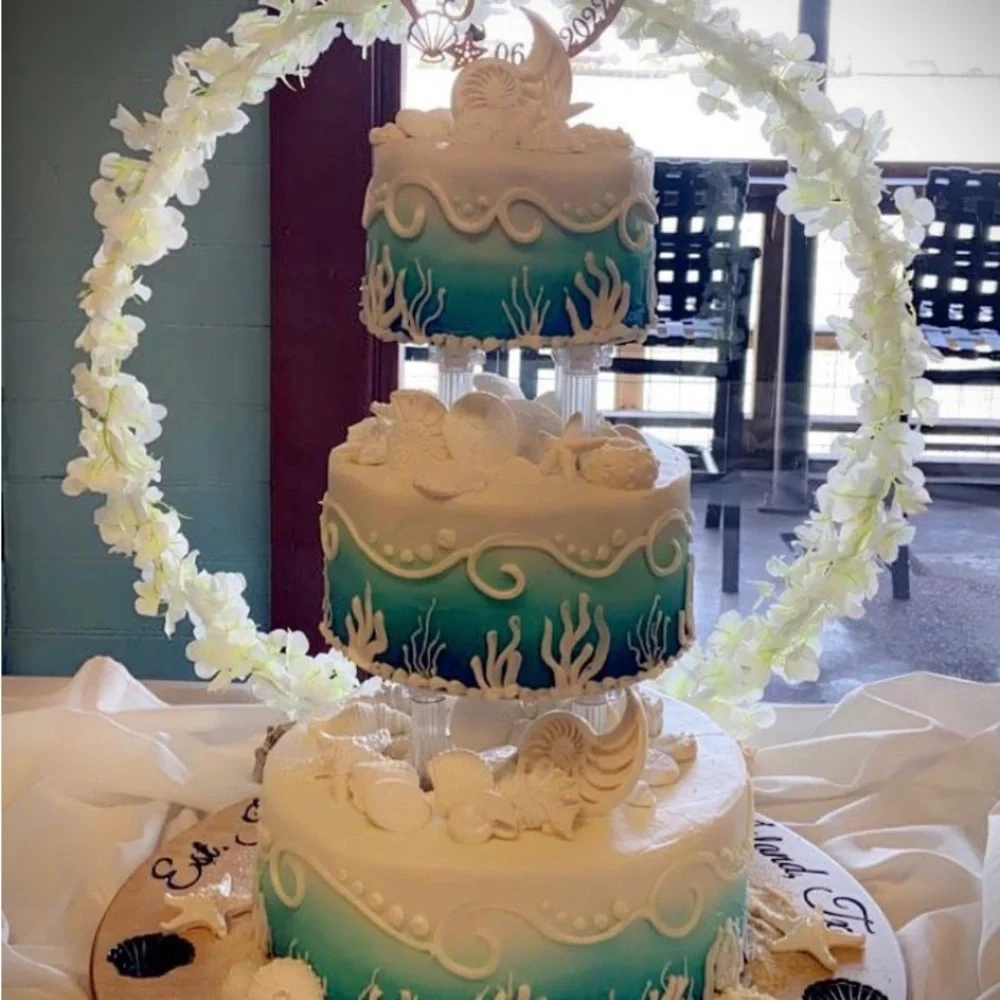 Cake hoop used for 3 tier cake made of iron and painted white. Has a sturdy base